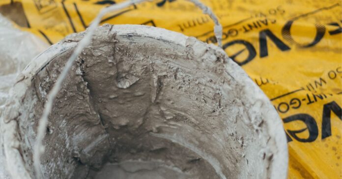 carbon footprint of concrete - the image shows a bucket of fresh concrete