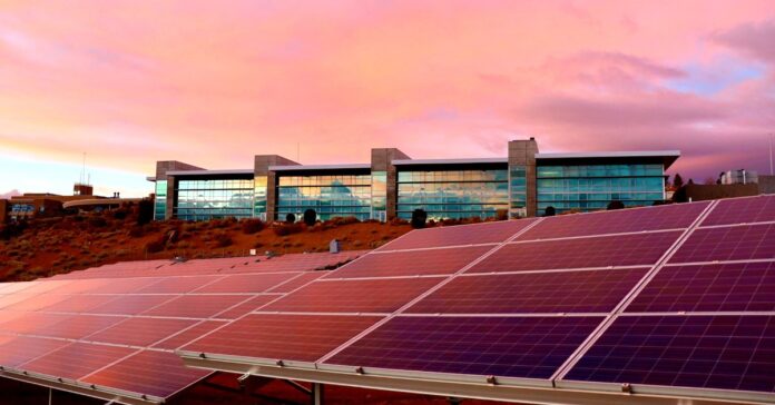 when were solar panels invented - the image shows a roof fulll of solar panels on a sunset