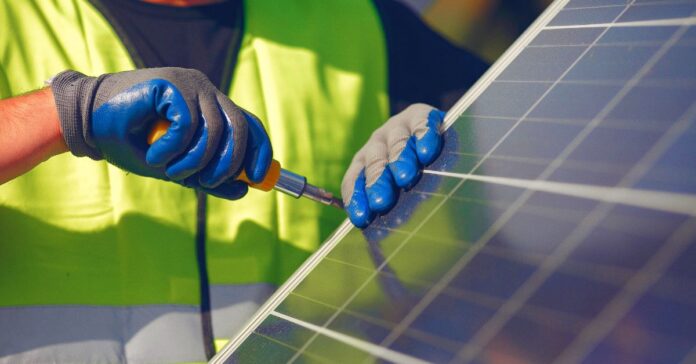 solar energy limitations - the image shows a professional installing a solar panel